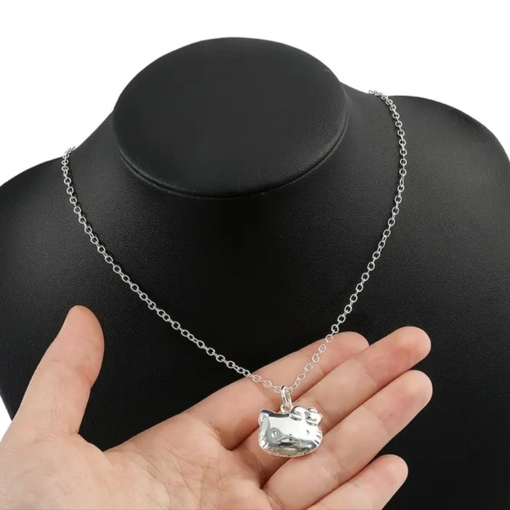 HELLO KITTY NECKLACE and SILVER PLATED ON 18" SILVER CHAIN, NEW